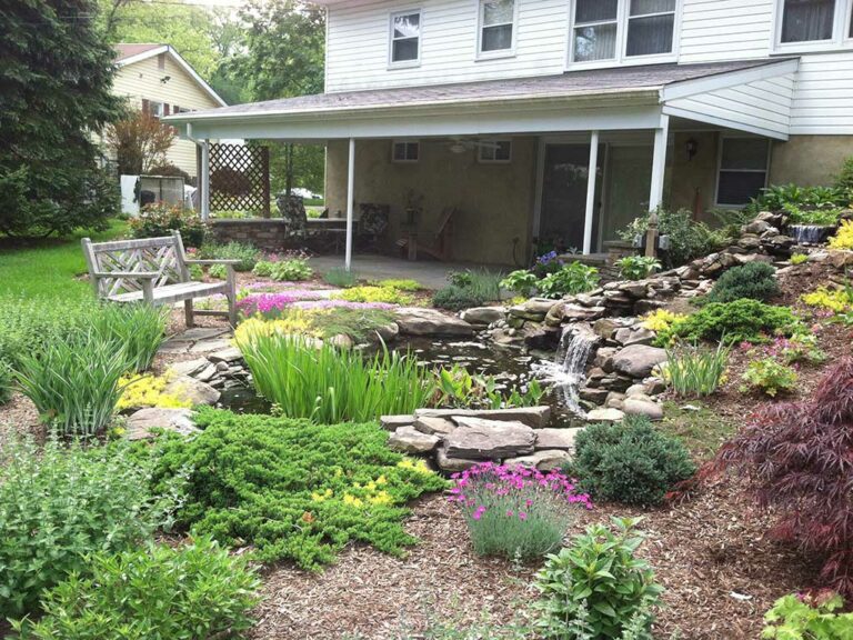 Transforming a Hillside into Pond and Waterfall - Claire Jones Landscapes